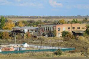 Old abandoned buildings of the former factory and warehouses. Th photo