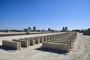 Cinder blocks lie on the ground and dried. on cinder block production plant. photo