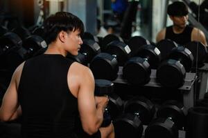 Exercise with dumbbells Lift weights to build strong arm muscles, an activity for good physical health. photo