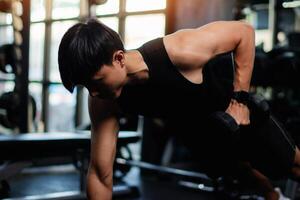Exercise with dumbbells Lift weights to build strong arm muscles, an activity for good physical health. photo
