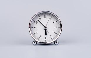 Time and work in daily life Photo of a modern clock in a high quality photo studio.