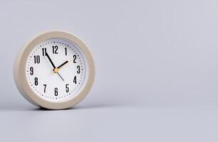 Time and work in daily life Photo of a modern clock in a high quality photo studio.