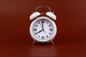 Time and work in daily life Photo of a modern clock in a high quality photo studio.