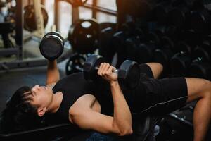 Exercise with dumbbells Lift weights to build strong arm muscles, an activity for good physical health. photo