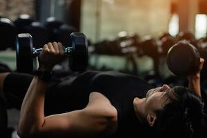Exercise with dumbbells Lift weights to build strong arm muscles, an activity for good physical health. photo