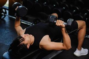 Exercise with dumbbells Lift weights to build strong arm muscles, an activity for good physical health. photo