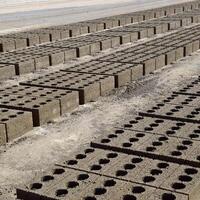 Cinder blocks lie on the ground and dried. on cinder block production plant. photo