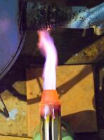 Heating a steel pipe with a blowtorch. The flame of a blowtorch photo