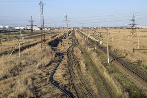 Plot railway. Top view on the rails. High-voltage power lines for electric trains photo