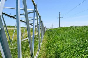 Assembly and installation of new support of a power line photo