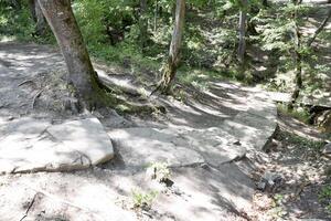 path laid out of stone slabs. A path in the mountains. photo