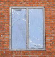 The window on the front of the building, fitted by the inside reflective film photo