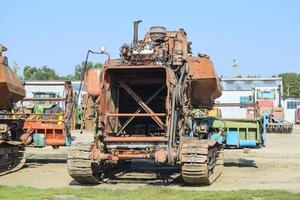 Old rusty disassembled combine harvester. photo