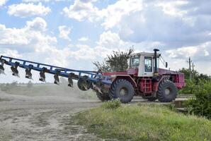 Tractor, standing in a row. Agricultural machinery. photo