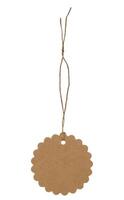 Round tag made of brown kraft paper with rope on isolated background photo