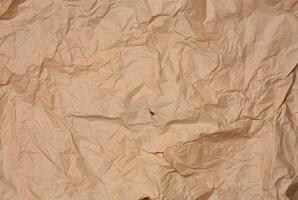 Crumpled brown parchment paper, full frame photo