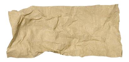 Crumpled piece of brown paper on isolated background photo