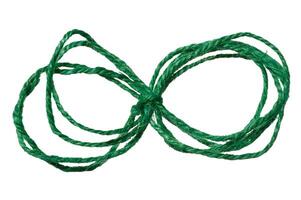 Green twine rope on a white isolated background, top view. Packing natural photo