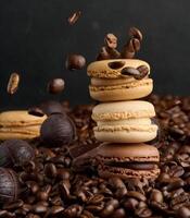 Stack of multi-colored macarons on a background of coffee beans, black background photo