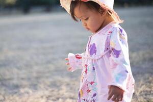 Little girl enjoying outdoor sports activities. photo