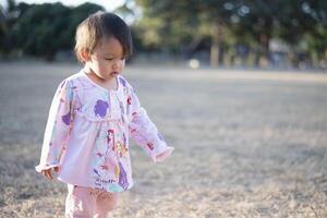 Little girl enjoying outdoor sports activities. photo