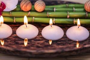 Spa composition with candles on water photo