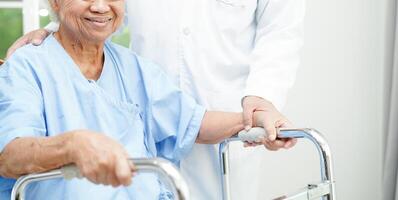 Doctor holding hands Asian elderly woman patient, help and care in hospital. photo