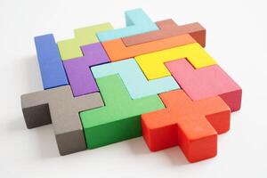 Logical thinking and problem solving problem solution creative business concept, wooden puzzle geometric block shape. photo