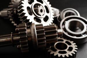 Metal gear wheel engine car and bike, mechanic industry concept. photo