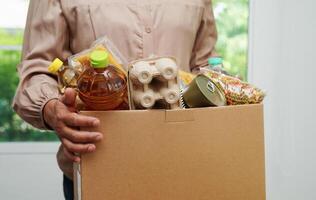 Foodstuffs in donation box for volunteer to help people. photo