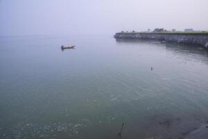 Natural Landscape view of the Bank of the Padma River with The Blue water photo