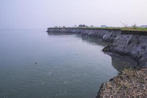 Natural Landscape view of the Bank of the Padma River with The Blue water photo