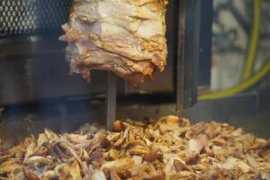 Turkish dish Doner Kebab as a turning roast photo