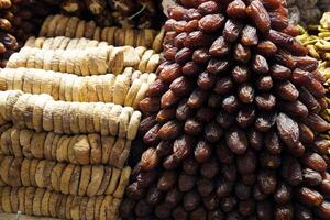 Dried figs and dates at the bazaar Istanbul market. Dried vegetables for to use at winter time. photo