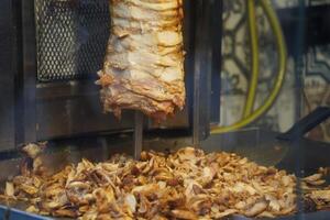 Turkish dish Doner Kebab as a turning roast photo