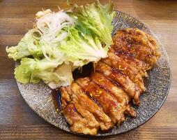 Grilled chicken fillet and fresh vegetable salad. Healthy lunch menu. Japanese food photo