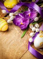 Easter background with flowers and Easter eggs photo