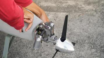 Engineer designing and assembling drones. Homemade aircraft made from resin and carbon fiber photo