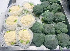 Close up broccoli and cauliflower in supermarket. The concept of health foods photo