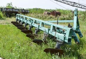 Plow on trailer for tractor. Plow for plowing soil. photo