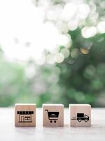 Wooden block with online shopping and e-commerce icons set. photo