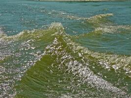 Waters of water from a motor boat in the river. photo