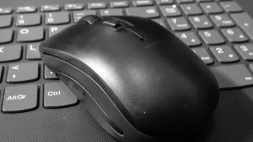 image of a black laptop keyboard and mouse photo