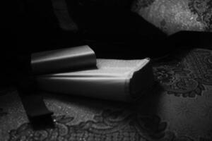 image of an open book on a table photo