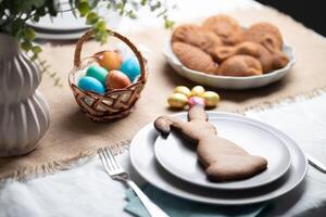 Gingerbread cookie shaped as Easter bunny on plate at decorated table photo