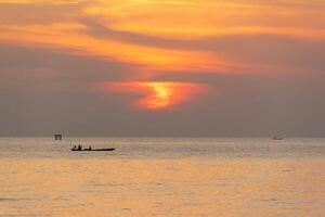 Beautiful sunrise in the sea and orange sky at Phuket city photo