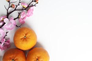 Top view of Mandarin oranges with customizable space for text or greetings. Chinese New Year concept photo