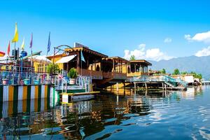 Dal Lake and the beautiful mountain range in the background, in the summer Boat Trip, of city Srinagar Kashmir India. photo