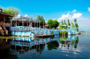 Dal Lake and the beautiful mountain range in the background, in the summer Boat Trip, of city Srinagar Kashmir India. photo