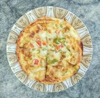 Chicken Fajita Pizza, spiced chicken cubes and cheese combination on bread, Italian food top view photo